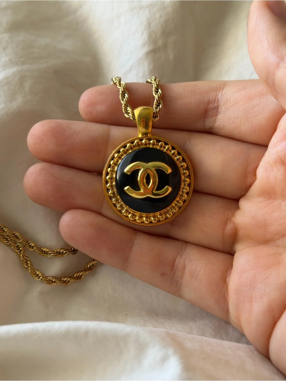 CHANEL Gold and Black Round CC Medallion Necklace
